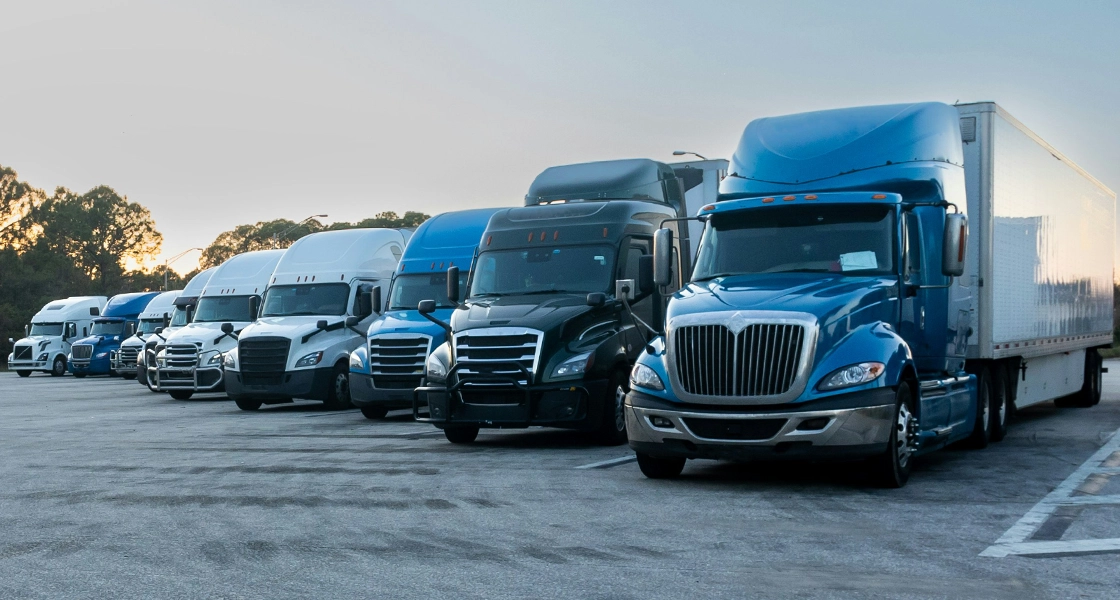 Semi trucks parked at a rest area